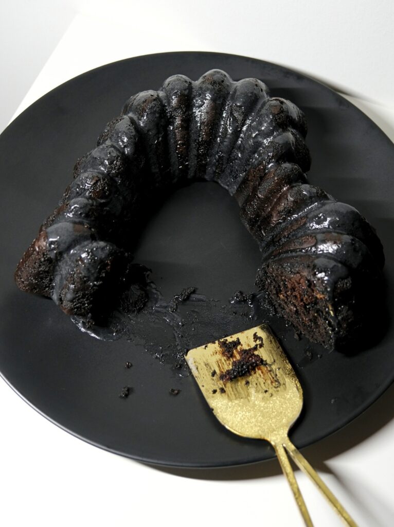 Black chocolate heart cake cut